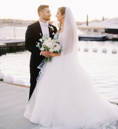 bride and groom on the pier