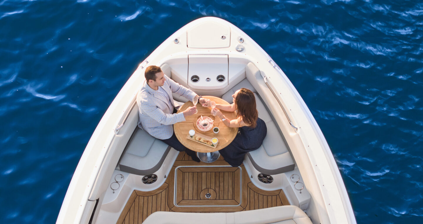 two people in a boat on the water