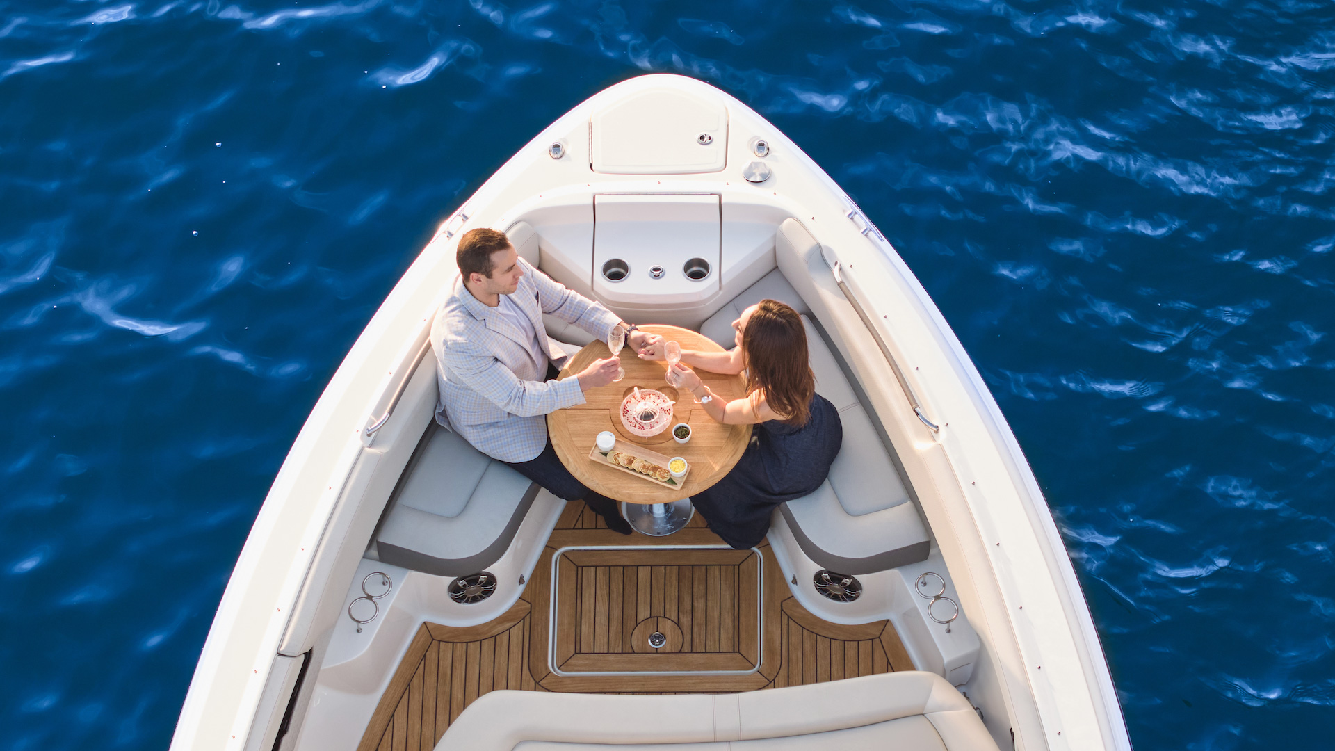 two people in a boat on the water